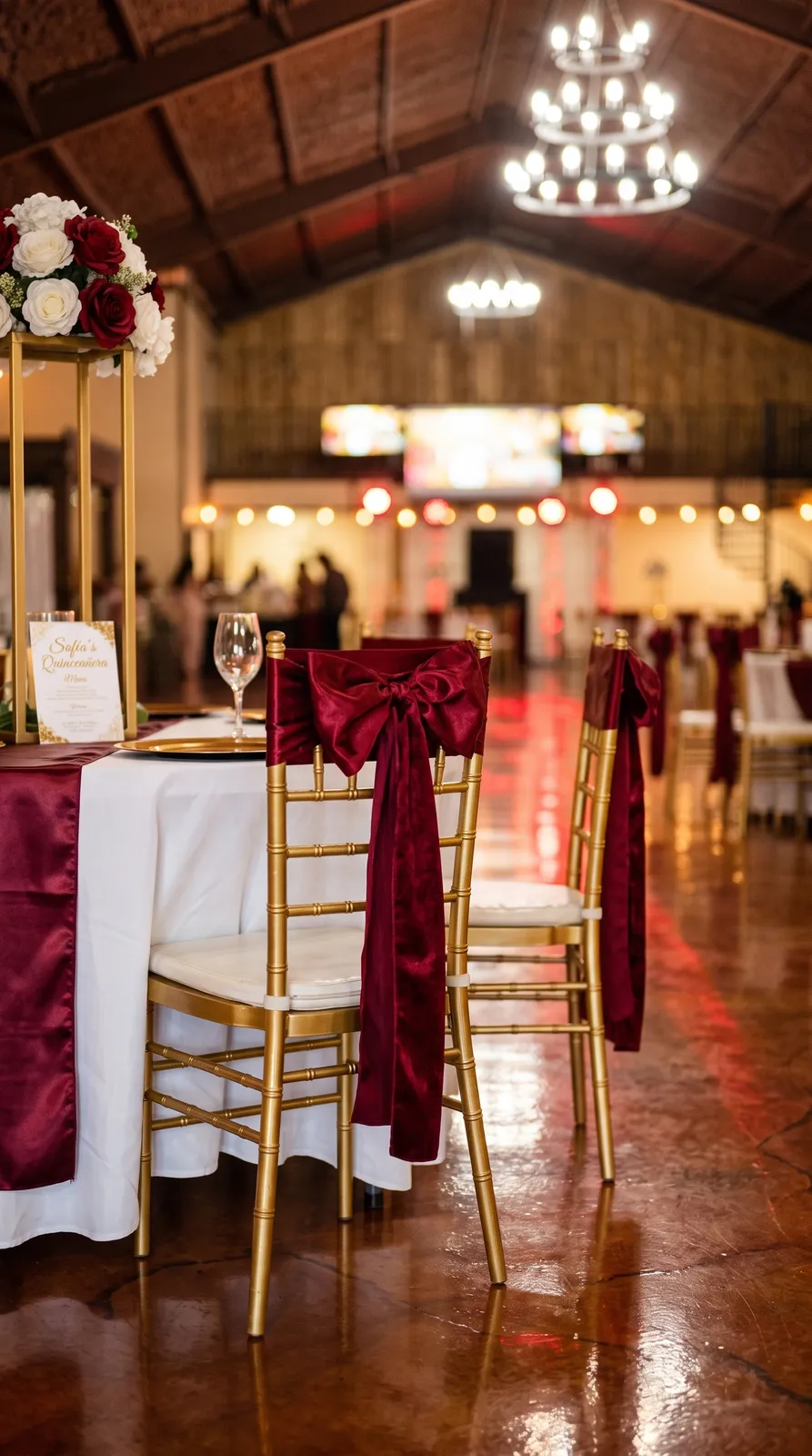 Gold Chiavari chairs with burgundy sashes at El Gran Caporal